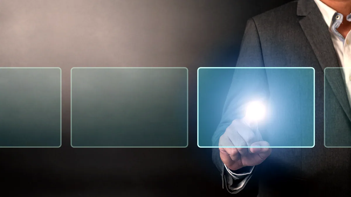 A dark touchscreen showing a row of glowing panels, one sliding open to reveal a menu.